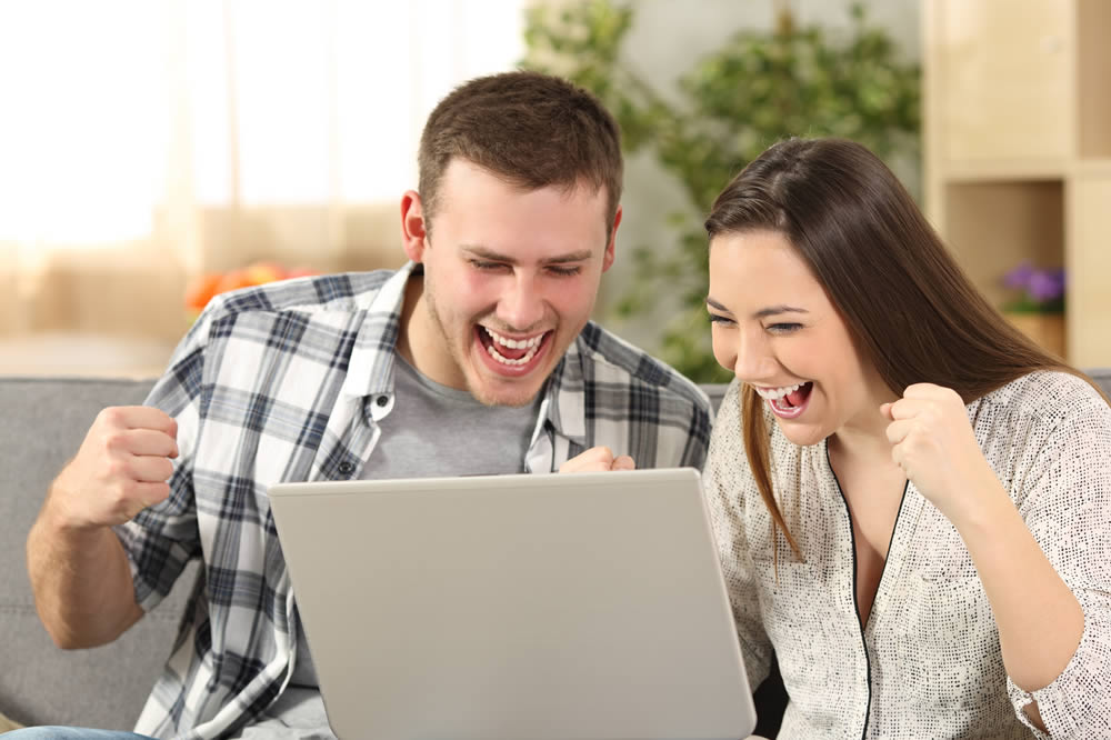 Photo of Couple and Computer